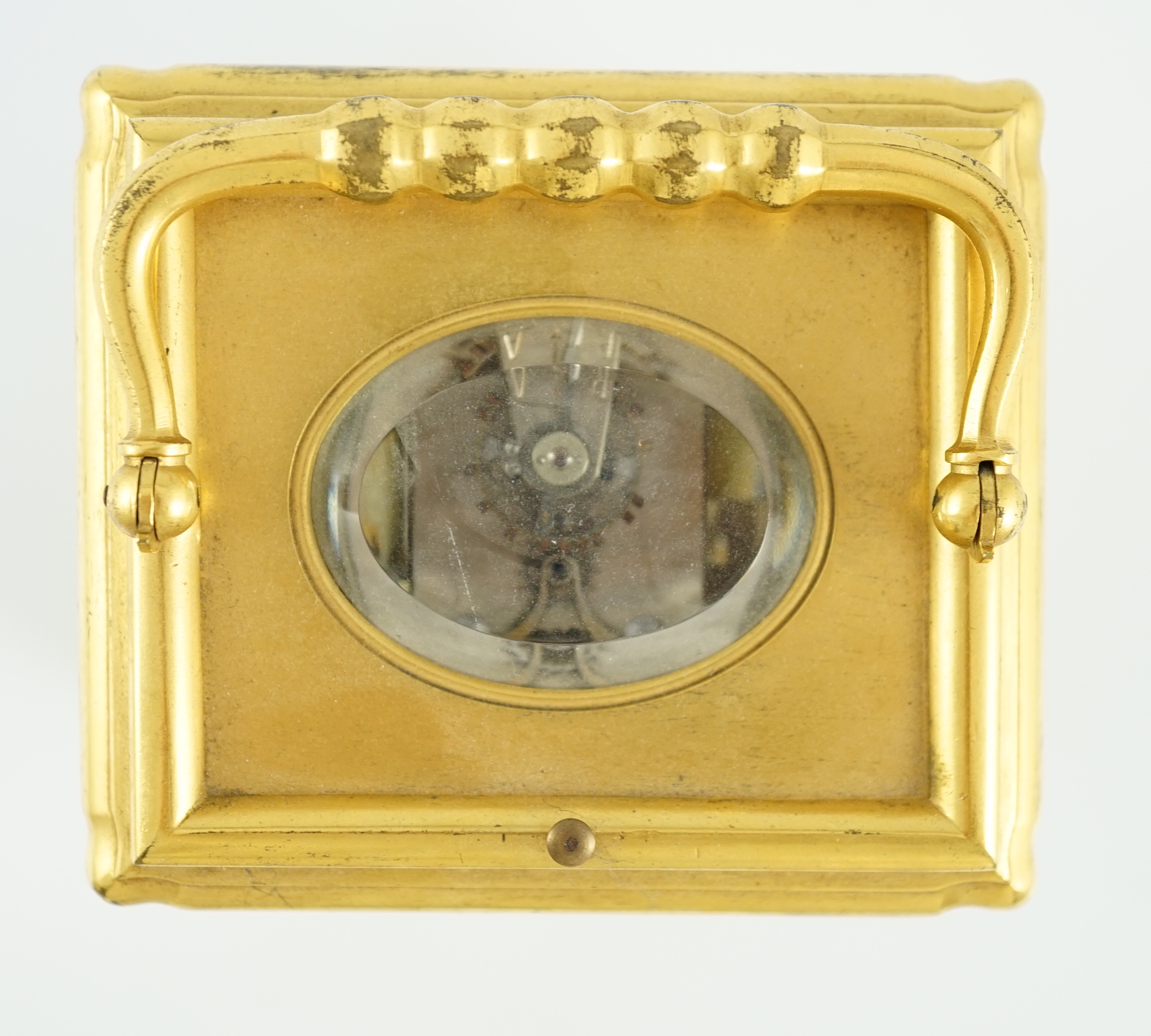 An early 20th century French ormolu Grande Sonnerie alarum clock, with enamelled Arabic dials and gorge case, movement striking on two blued steel gongs, 10cm wide, 9cm deep, 15.5cm high
